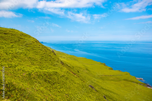 The coastal landscape at Isle of Skye, a big island in north highlands, Scotland, on a sunny day.