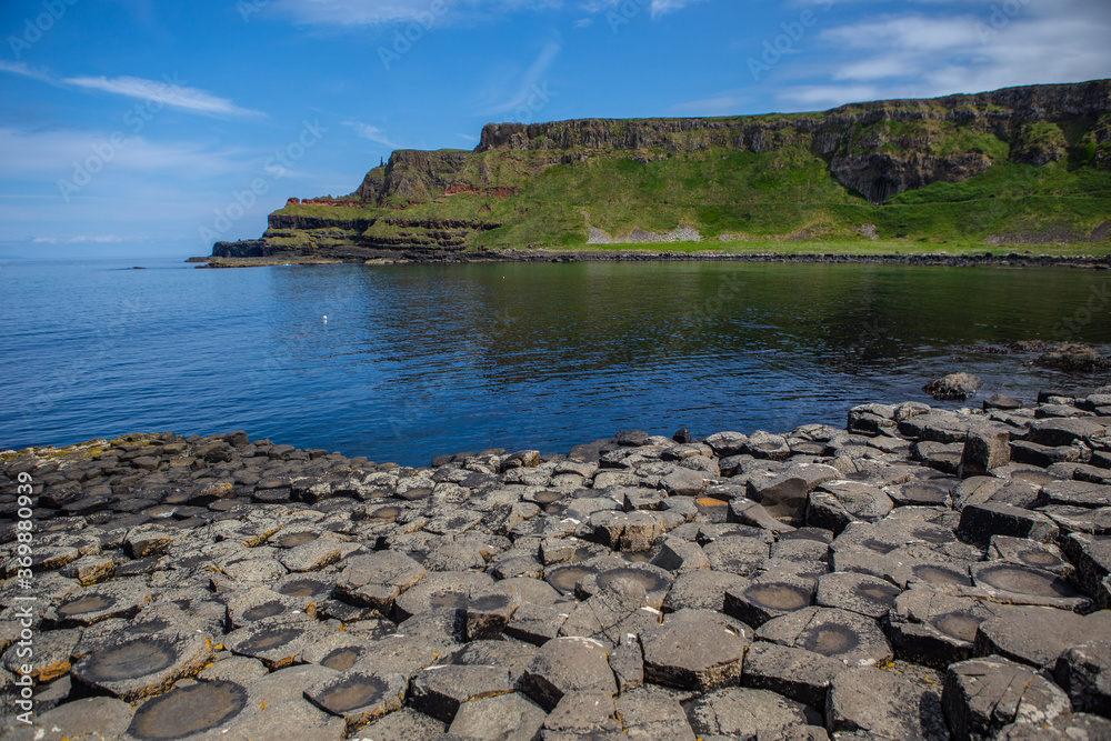 The coastal view of Giant's Causeway, in North Ireland, on a cloudy day.