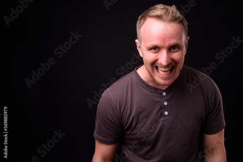 Portrait of happy handsome man with blond hair © Ranta Images