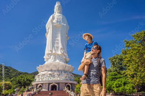 Dad and son tourists in Chua Linh Ung Bai But Temple, Lady Buddha Temple in Da Nang, Vietnam. Traveling with children concept photo