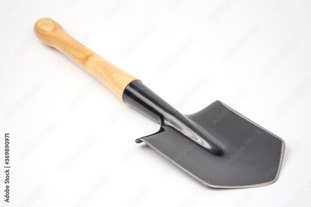 small shovel for tourism and earthworks on a white background small shovel for tourism and earthworks on a white background