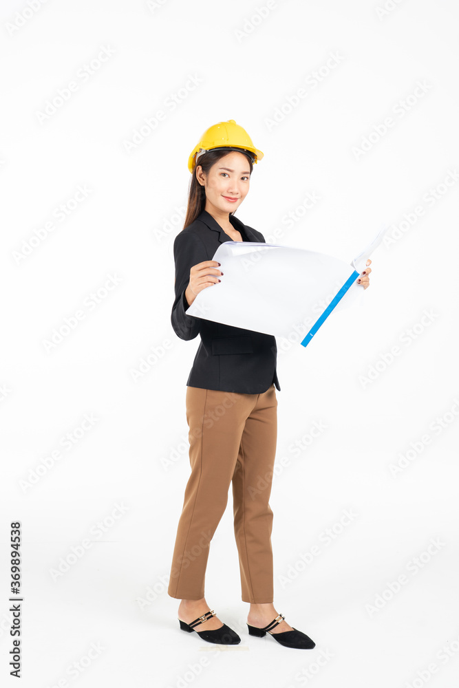 Asian business woman in safety helmet holding engineering blueprint isolated on white background, asian model Asian business woman in safety helmet holding engineering blueprint isolated on white background, asian model