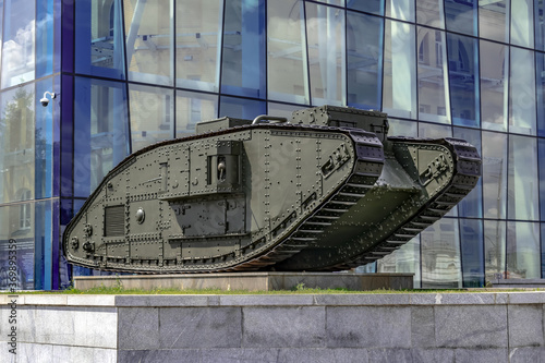 Kharkiv, Ukraine - July 20, 2020: Mark V Composite tank on Constitution Square against the background of the blue glass wall of the Kharkiv Historical Museum. Monument from the First World War photo