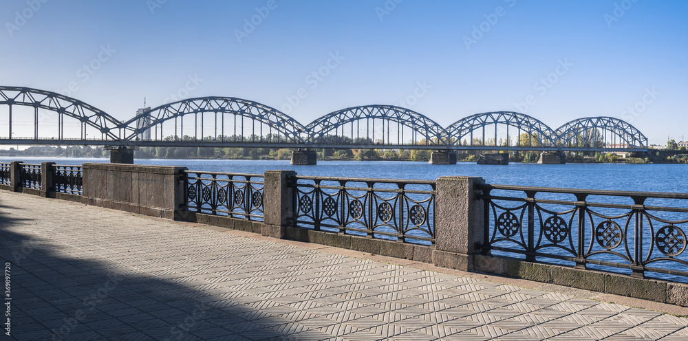 The Stone Bridge (Akmens tilts) and the Railway Bridge (Dxelzcela tilts) across Daugava river, Riga, Latvia.