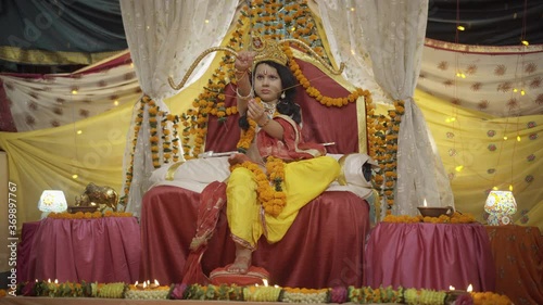 Indian kid in the costume of Lord Rama for celebrating Ramlala Temple construction in Ayodhya. Apple prores 422 4k. photo