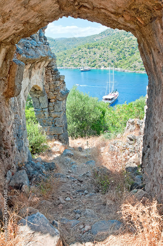 The sea view from the ruined arch of St. Nicholas church on Gemiler Island, Fethiye, Turkey photo