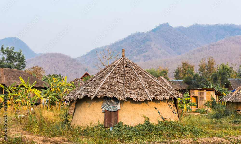 a small Hut set surrounded by rice fields, Pai, Thailand.