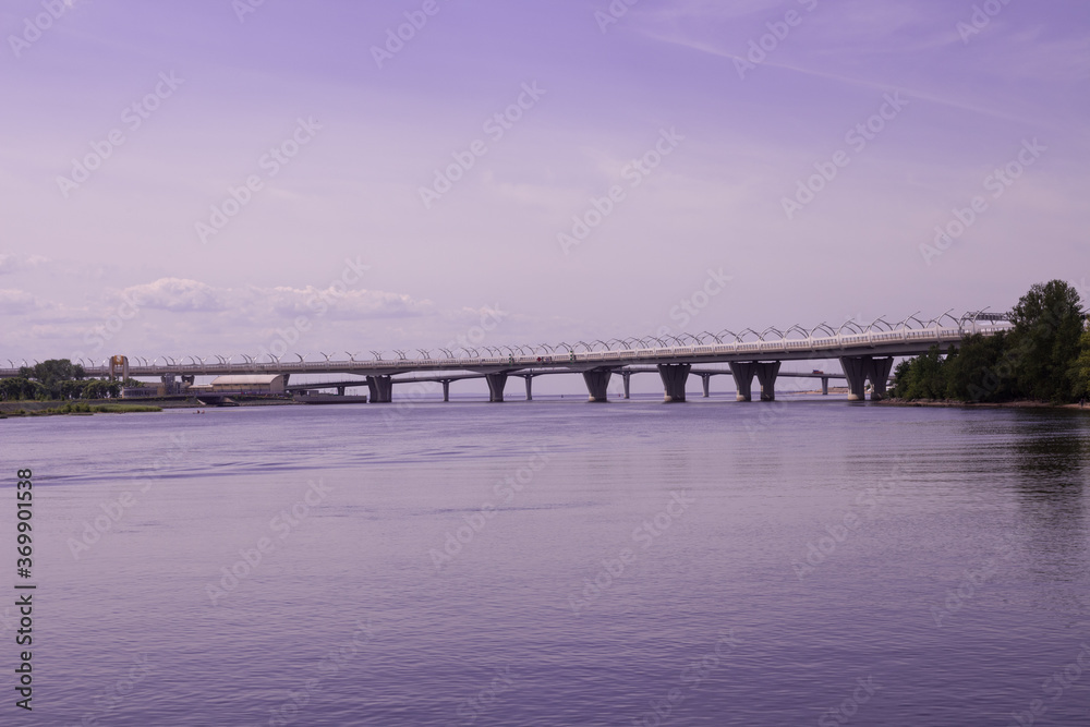 View of the water and two bridges: automobile and pedestrian on a lilac background.