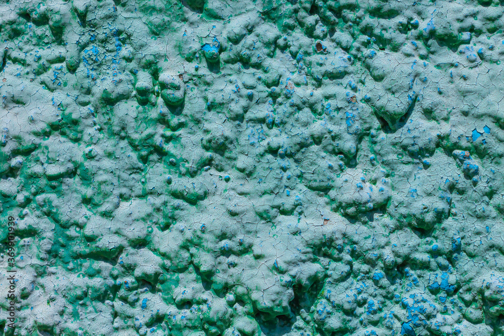 Old turquoise plaster wall texture. Retro painted putty building background with copy space. Stylish blue surface, detailed stones backdrop. Wallpaper textured screensaver front view for text design. Old turquoise plaster wall texture. Retro painted putty building background with copy space. Stylish blue surface, detailed stones backdrop. Wallpaper textured screensaver front view for text design.