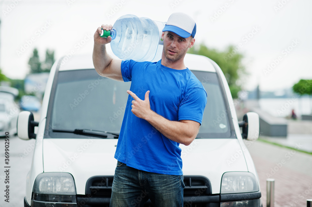 Delivery man in front cargo van delivering bottles of water showing finger. Delivery man in front cargo van delivering bottles of water showing finger.