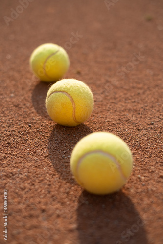 Tennis ball on the court. Sports equipment for active lifestyle. Ball and court as a background.
