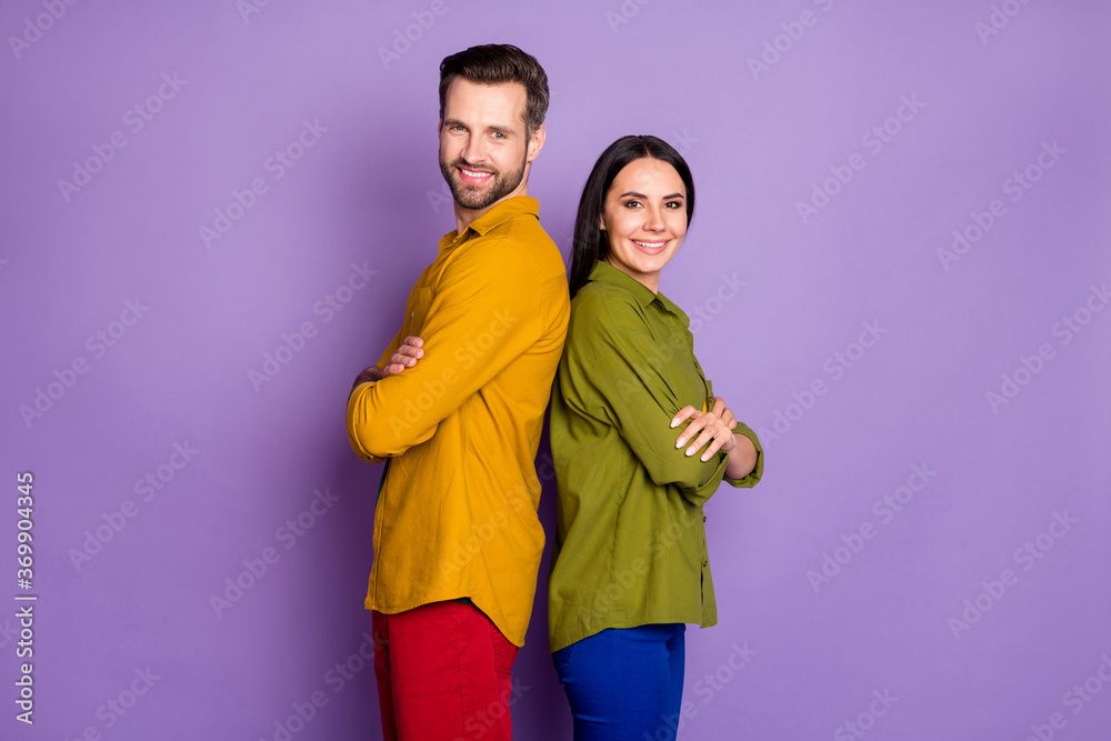 Fototapeta premium Profile photo cool lady handsome guy stand back-to-back arms crossed confident partners team toothy smiling wear casual shirts pants outfit isolated purple color background