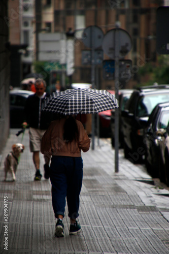Woman with umbrella in a rainy day