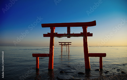 The morning sun which shines in the shrine in the Japanese sea
