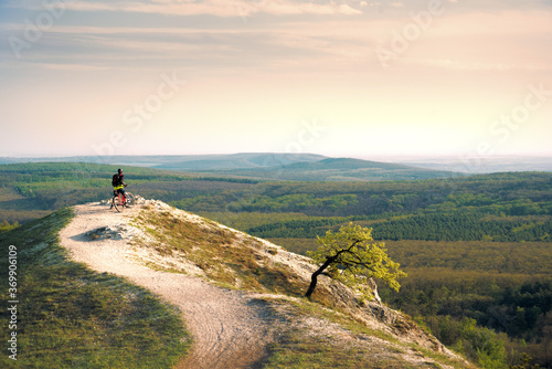 Trail in the mountains, bicyclist 