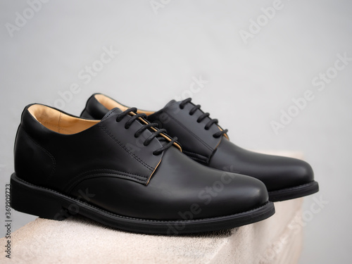 Men fashion black derby shoes leather on the floor. 