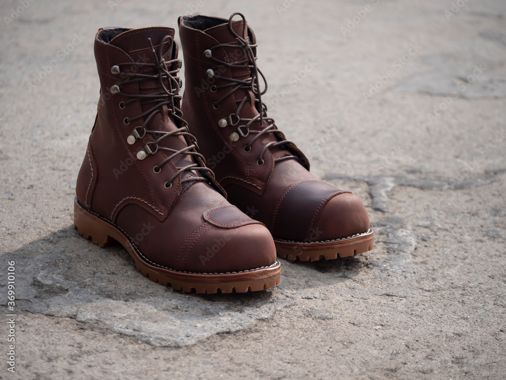 Men fashion brown boots leather on the floor. Men fashion brown boots leather on the floor.