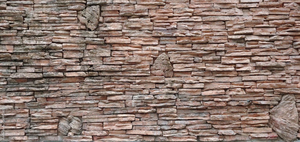 Obraz premium a brick wall of coarse red brick