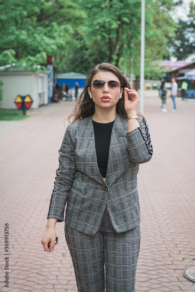 Fashionable young woman relaxing on a summer day in the city