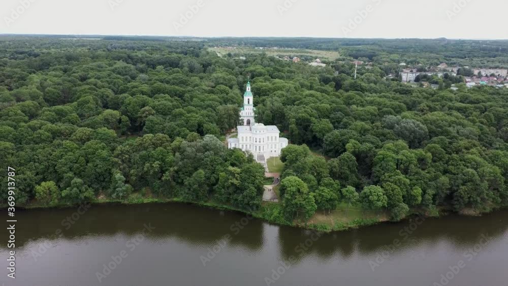 Picturesque place of white. Palace with pond and green trees. Picturesque place of white. Palace with pond and green trees.