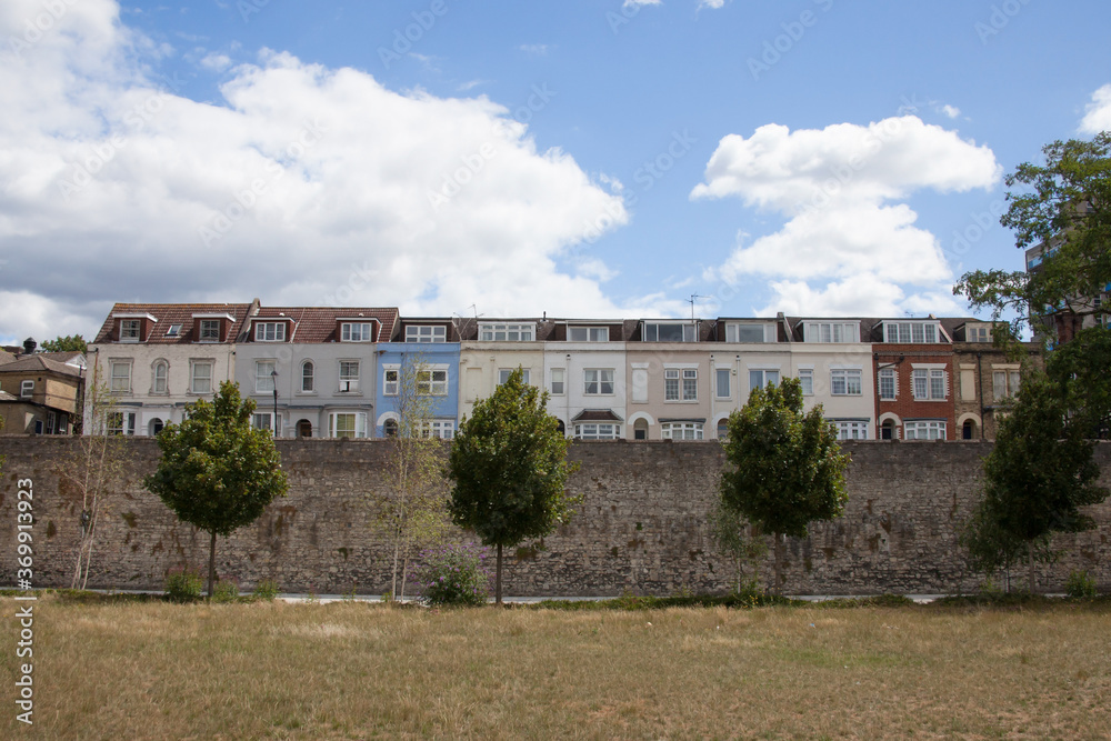 Multi coloured terraced housing on the Town Wall in Southampton, Hampshire in the United Kingdom