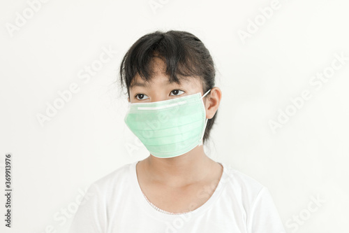 Portrait of Asian young girl wearing a face mask 