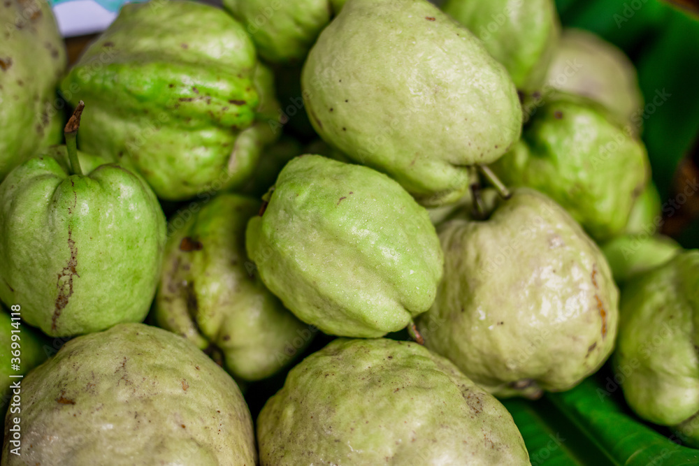 The blurred abstract background of fruits placed in a basket (lemon, guava) can be used for cooking or as a healthy alternative. The blurred abstract background of fruits placed in a basket (lemon, guava) can be used for cooking or as a healthy alternative.