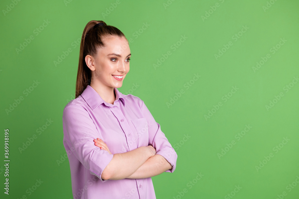 Profile side photo of positive cheerful optimistic girl cross hands listen her colleagues decision choice solution wear violet outfit isolated over green color background Profile side photo of positive cheerful optimistic girl cross hands listen her colleagues decision choice solution wear violet outfit isolated over green color background
