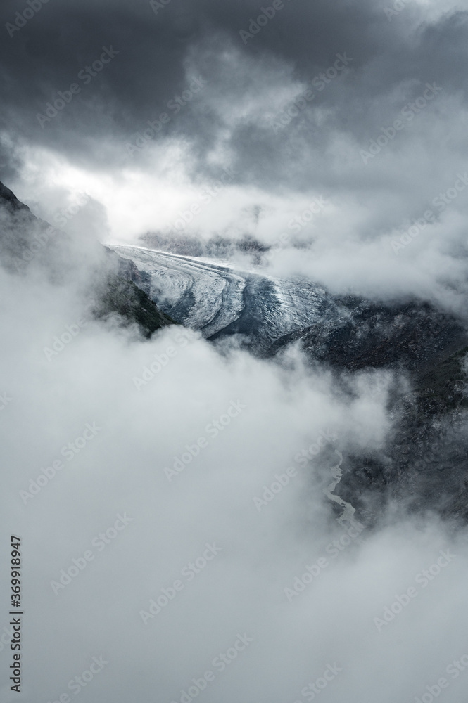 Aletsch Glacier surrounded by clouds