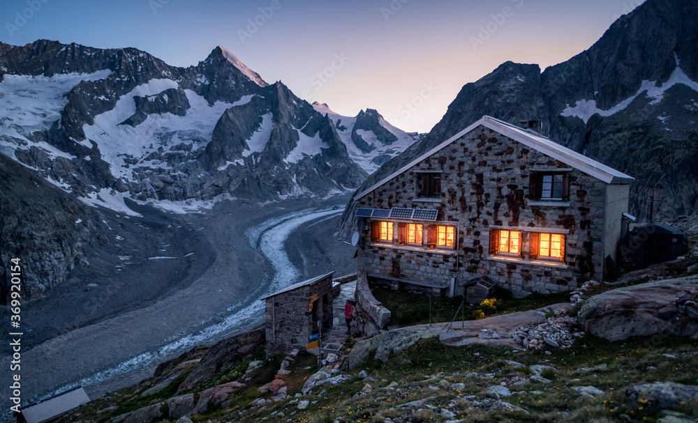 blue hour at an alpine hut in the swiss alps