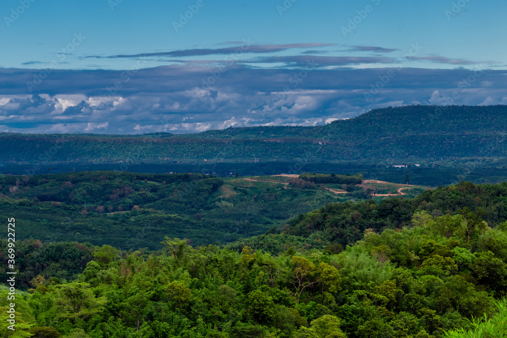 Naklejka premium Natural high angle panoramic background With an atmosphere surrounded by mountains and trees, with a blurred wind, cool