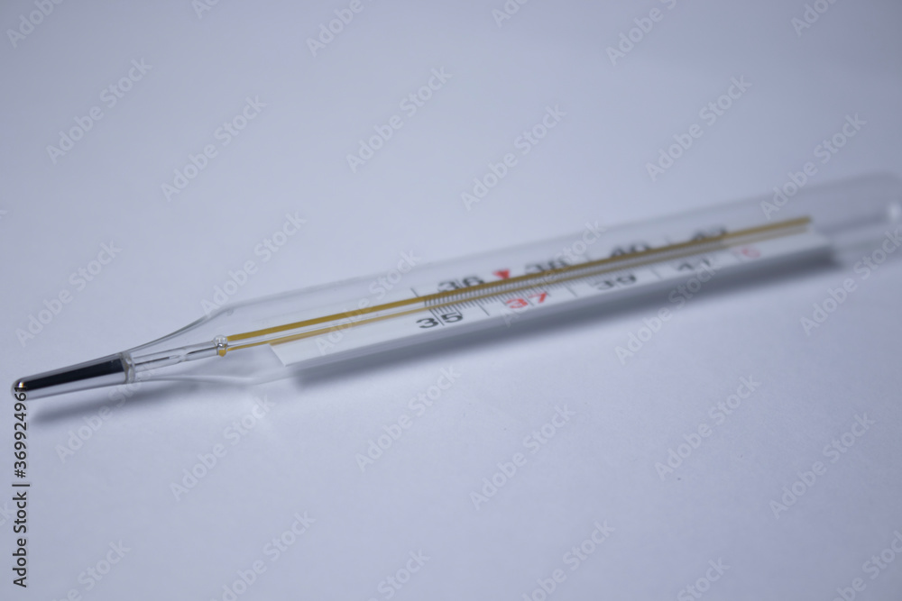 mercury thermometer on a white background. medicine and disease concept. Isolated. High quality photo mercury thermometer on a white background. medicine and disease concept. Isolated. High quality photo