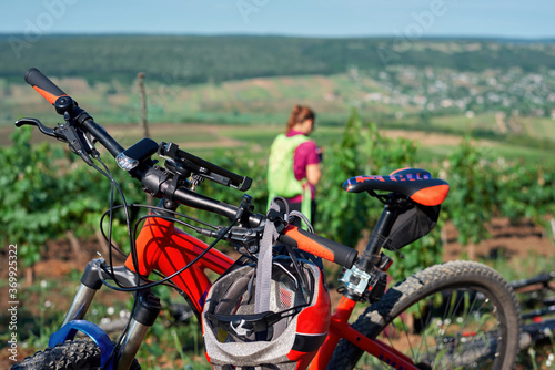 Parked bicycle and woman