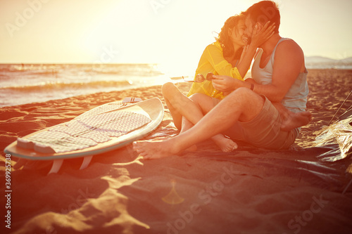 Sticker Young attractive surfing couple kissing