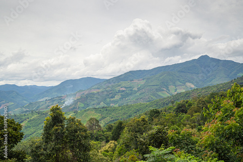 Scenic view of mountains against cloud sky