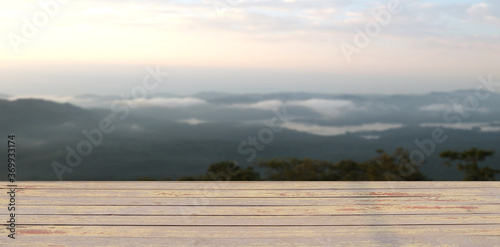 shelf floor with light mist in morning sunrise on the mountain for the background. © สมปอง ป้องปิด