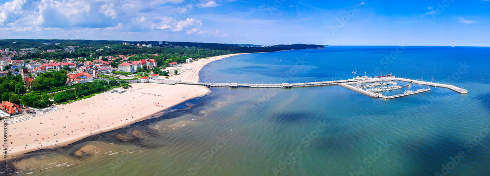 Panorama of the Baltic sea coastline with wooden pier in Sopot, Poland - obrazy, fototapety, plakaty 