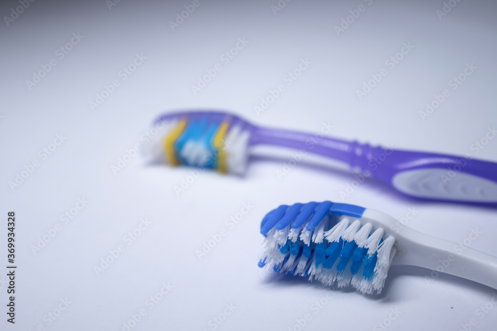two toothbrushes on a white background. healthy and clean teeth concept, dentistry. High quality photo two toothbrushes on a white background. healthy and clean teeth concept, dentistry. High quality photo