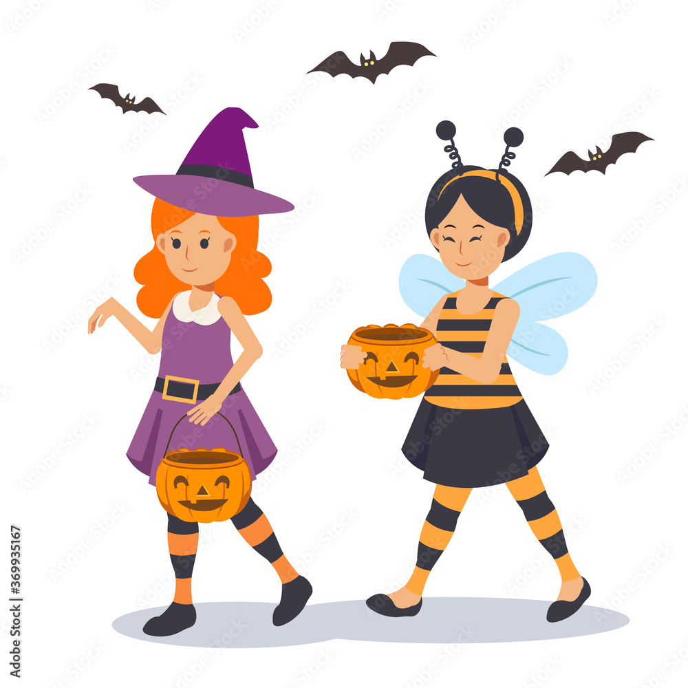 Obraz premium 2 little cute Girls in Halloween costume are enjoy. trick or treat. Cute witch , honey bee.