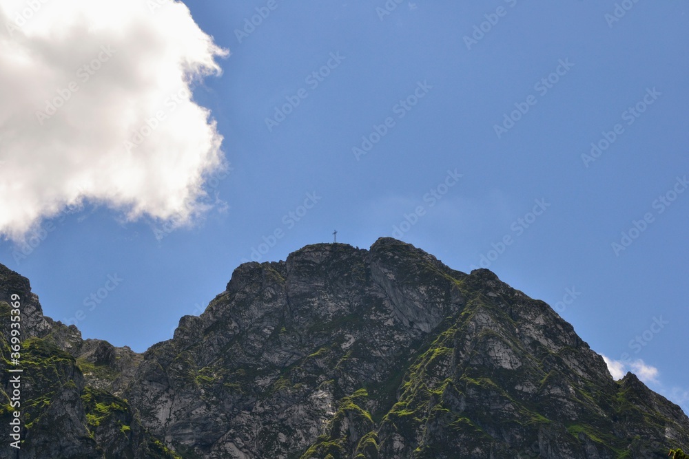 Giewont with cross on the top. Mountain massif in the Tatra Mountains of Poland. A mountain-symbol, whose profile is associated with the silhouette of a sleeping knight
