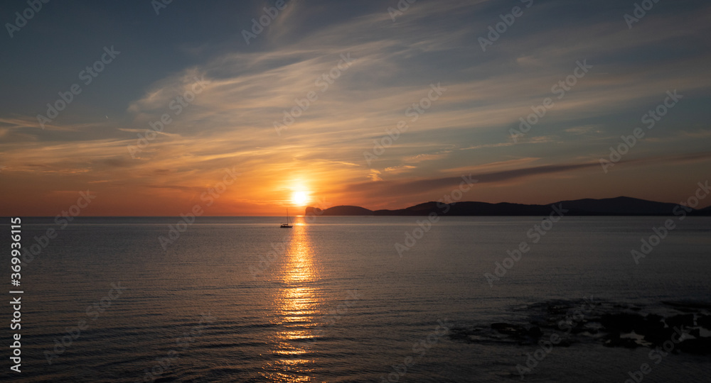 view of the Spanish tower of the ramparts of Alghero and in the background head hunting view of the Spanish tower of the ramparts of Alghero and in the background head hunting