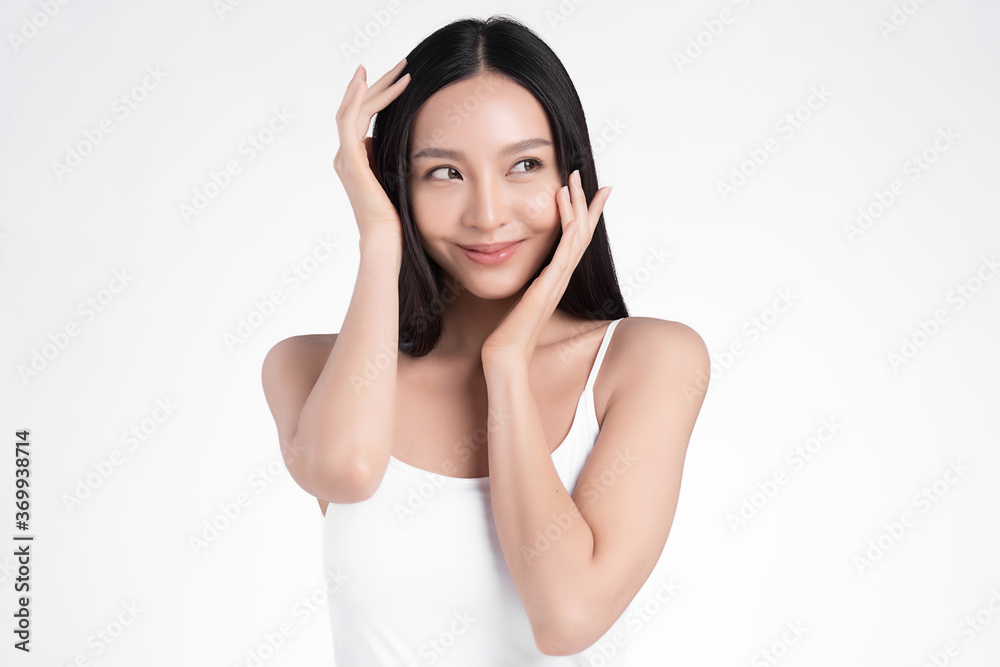 Beautiful Young asian Woman with Clean Fresh Skin, on white background, Face care, Facial treatment, Cosmetology, beauty and spa, Asian women portrait Beautiful Young asian Woman with Clean Fresh Skin, on white background, Face care, Facial treatment, Cosmetology, beauty and spa, Asian women portrait
