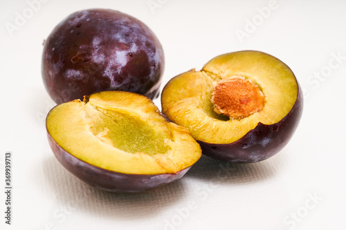 Natural juicy plum cutaway on white background 