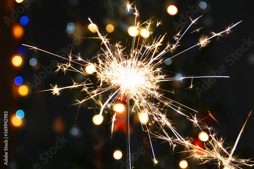 Lights. Sparks. Christmas background. Christmas lights close up. Celebration
