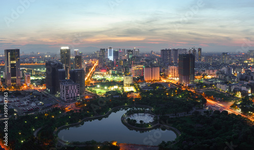 Cityscape of Hanoi skyline at Cau Giay park during sunset time in Hanoi city, Vietnam