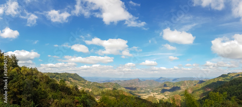 Landscape mountain view with sky and clouds.