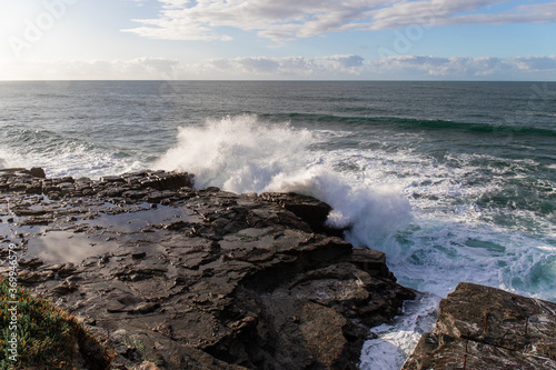Wave crashing on the rock in the coastline.