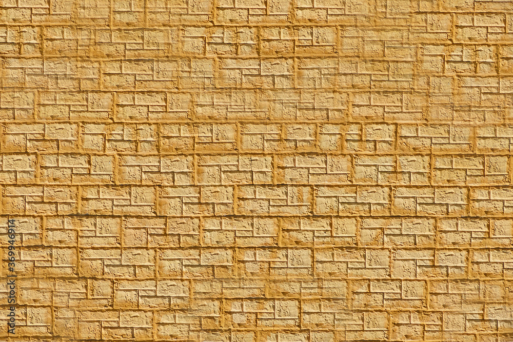 The brick texture. A fragment of yellow facing brick masonry in close-up. The brick texture. A fragment of yellow facing brick masonry in close-up.