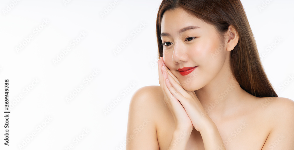 Charming young woman touching her face with clean fresh skin. Teenager cute girl with perfect fresh clean skin over isolated white background. Beauty and cosmetics concept. Charming young woman touching her face with clean fresh skin. Teenager cute girl with perfect fresh clean skin over isolated white background. Beauty and cosmetics concept.