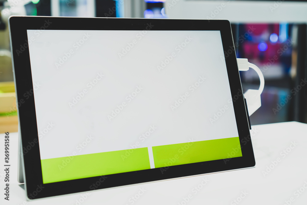 E-learning study, Mockup of tablet on desk for business Live streaming in new normal working online meeting with blank white screen in information technology center at university E-learning study, Mockup of tablet on desk for business Live streaming in new normal working online meeting with blank white screen in information technology center at university